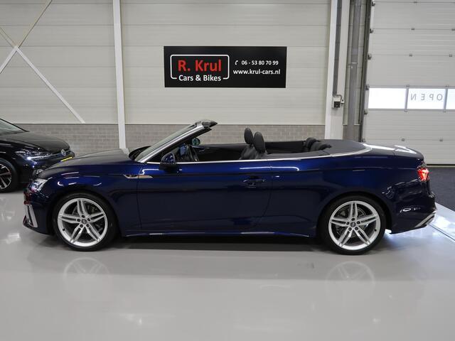 Audi A5 Cabriolet 40 TFSI Launch edition Sport S-Line Matrix Nekverwarming Trekhaak 3-Zone airco Digitaal Camera ACC Navigatie Automaat Alcantara Massagestoelen App connect 19 inch Sportvelgen Navarrablauw metallic Nieuwstaat