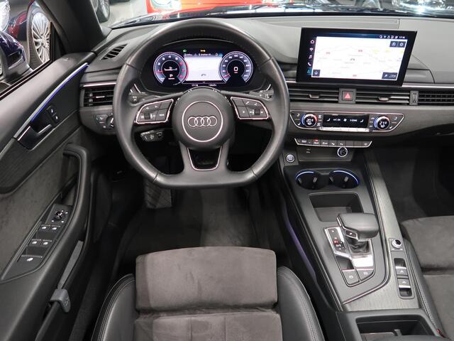 Audi A5 Cabriolet 40 TFSI Launch edition Sport S-Line Matrix Nekverwarming Trekhaak 3-Zone airco Digitaal Camera ACC Navigatie Automaat Alcantara Massagestoelen App connect 19 inch Sportvelgen Navarrablauw metallic Nieuwstaat