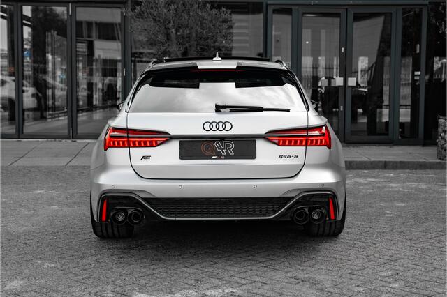 Audi RS6 ABT RS6-S Avant 4.0 TFSI quattro 700pk | Audi Exclusive Floret Silver matte | Carbon optiek | Dynamic plus | Keramische remmen | Design pakket rood | Alcantara hemel | Panorama dak | Assistentiepakket plus | B&O Premium audio | Carbon spiegels | Carnon in