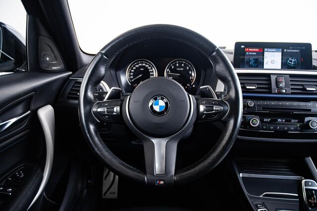 BMW 1-SERIE M140i High Executive Schuif/kanteldak - Comfort Access - Cruise Control - Driving Assistant - Variable Sport Steering - Sportstoelen - Verwarmde voorstoelen - HiFi System Harman Kardon - Lichtpakket -