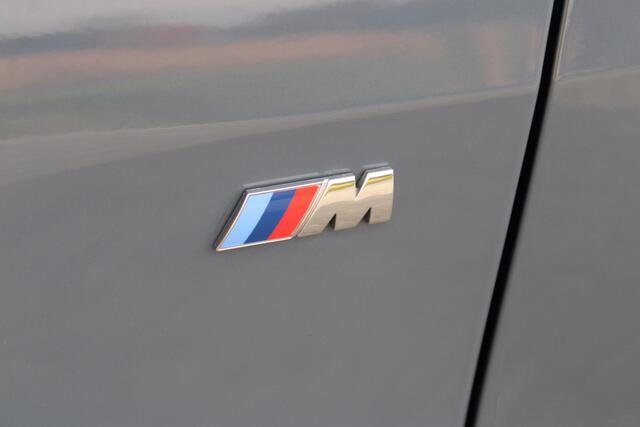 BMW 1-SERIE 118i High Executive M-sport | Incl. 12 maanden garantie | Cruise control | Kuipstoelen | Schuif/kantel dak | Climate control | Apple carplay | Navigatie | DAB radio | Harman/Kardon |