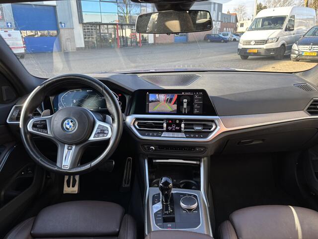 BMW 3-SERIE Touring /320e Business Edition Plus M Sport Pakket / Portimao Blau / Stoel & Stuurverwarming / Wegklapbare Trekhaak /
