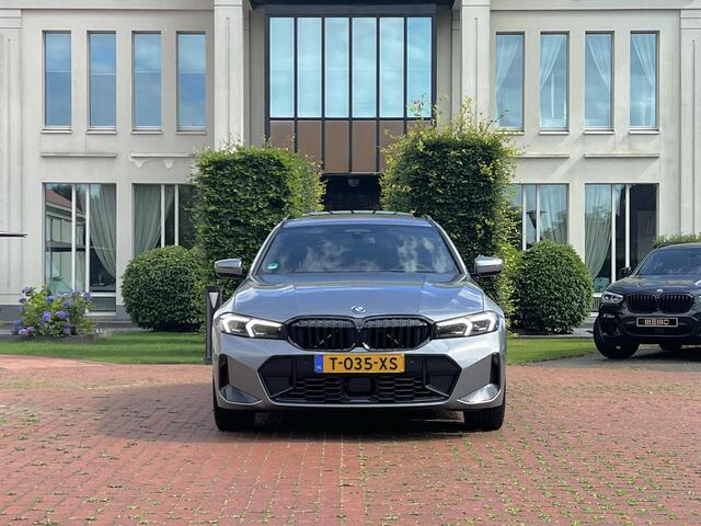 BMW 3-SERIE Touring 320e Carbon inleg - Harmen Kardon - Panoramadak - Trekhaak