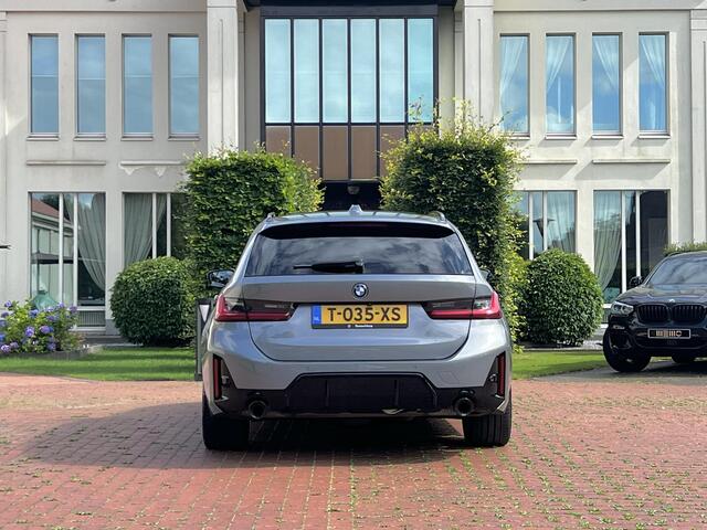 BMW 3-SERIE Touring 320e Carbon inleg - Harmen Kardon - Panoramadak - Trekhaak