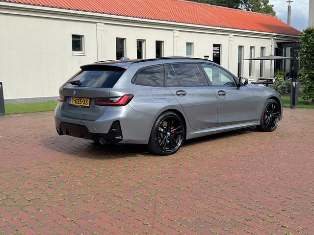BMW 3-SERIE Touring 320e Carbon inleg - Harmen Kardon - Panoramadak - Trekhaak