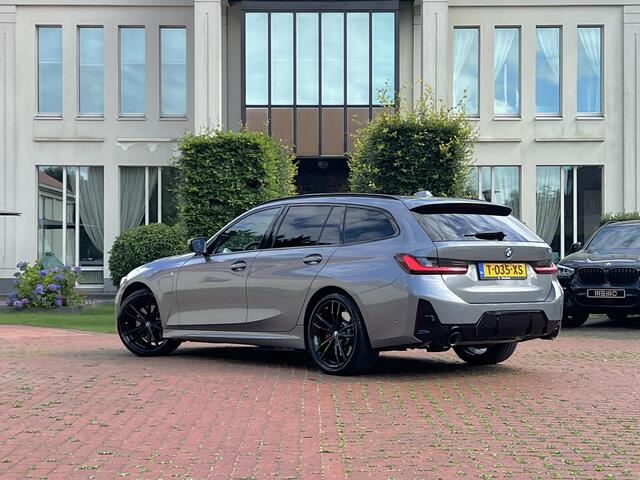 BMW 3-SERIE Touring 320e Carbon inleg - Harmen Kardon - Panoramadak - Trekhaak