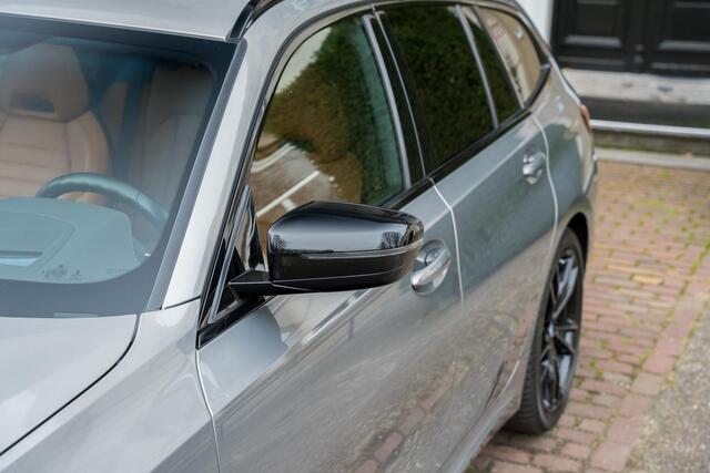 BMW 3-SERIE Touring 330e High Executive TREKHAAK | PANO | KUIPSTOELEN | LASER | ACC | H&K