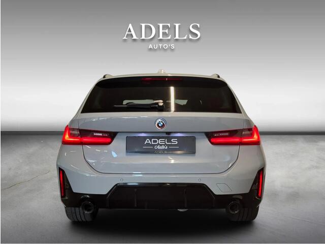 BMW 3-SERIE Touring 330e xDrive M Sport Panodak HUD Trekhaak Harman Kardon Camera ACC Brooklyngrau