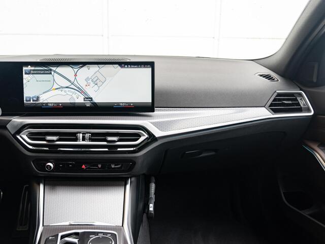 BMW 3-SERIE Touring 320e | M Sportpakket | Travel Pack | 19 inch | Glazen panoramadak | HiFi | Sportstoelen
