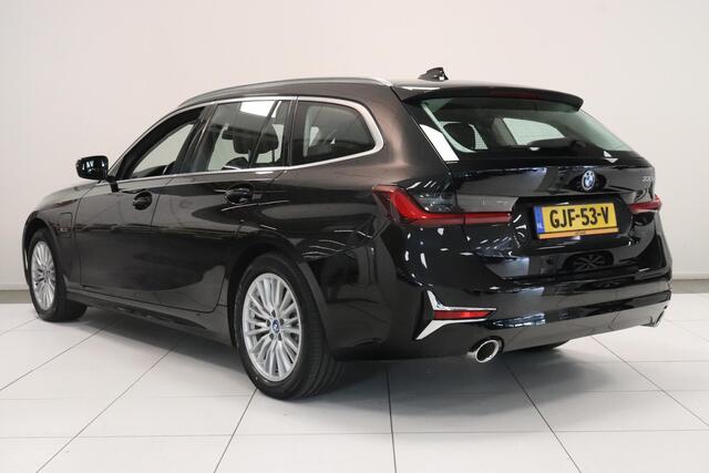 BMW 3-SERIE Touring 330e Business Edition Plus | Climate control | SoH 91,7% | Leder | Parkeersensoren | AppleCarplay AndroidAuto | Stoelverwarming | Elek achterklep |