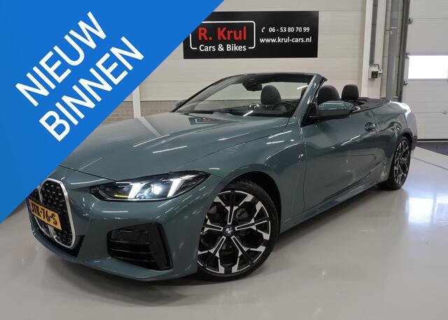 BMW 4-SERIE Cabrio 420i High Executive M-Sport Sportstoelen Camera Stoelverwarming Curved dashboard Navigatie Airco-ecc 19 inch Sportvelgen App connect Cape York Green metallic Zwart sportleer