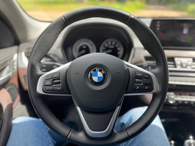 BMW X1 sDrive 2.0i 178pk High Executive ecc,lmv,led,navigatie,trekhaak,leer,sportstoel