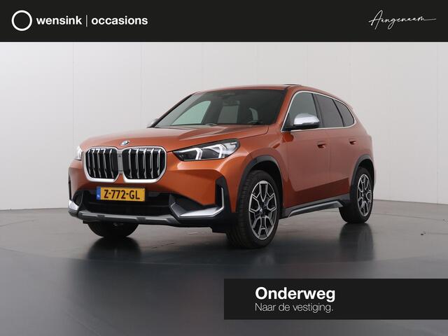 BMW X1 sDrive18i | X-Line | Panoramadak | Sportstoelen | Curved Display | Camera | DAB | Apple CarPlay/Android Auto | Ele. verstelbare stoel + Geheugen | Harman/Kardon | Ele.kofferdeksel | Rijassistent Systeem |
