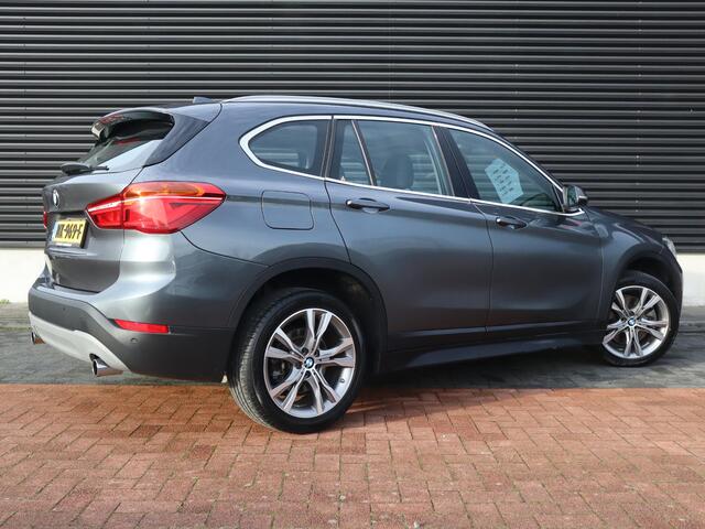 BMW X1 sDrive20i Centennial High Executive | Clima | Cruise | Navi | Leder | Stoelverwarming | Pano | Parkeer-assistent |