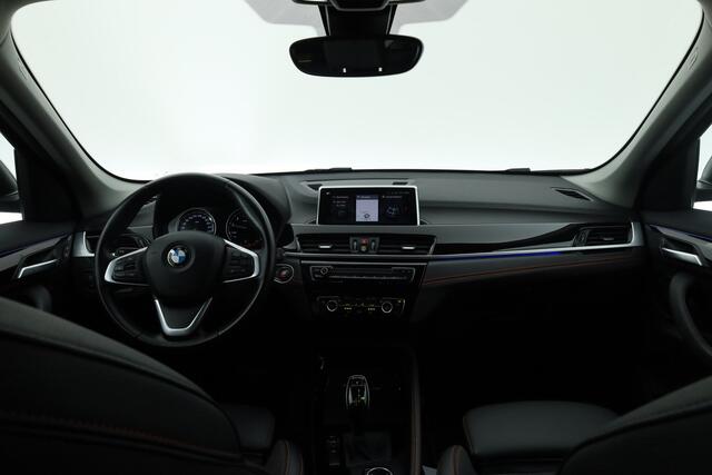 BMW X1 sDrive20i 192PK High Executive - Automaat | Afn. Trekhaak | Nav | Cruise | ACC | Led | Elek. Klep | Sfeerverl. | PDC | 1800kg trekg. V