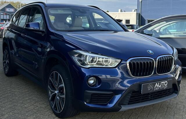 BMW X1 sDrive18i High Executive | NL AUTO | Automaat | Achteruitrijcamera | Navigatie | Parkeersensoren Voor en Achter | Lederen Bekleding | Stoelverwarming | Elektrische Achterklep | 2 Sleutels |