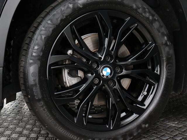 BMW X1 sDrive18i High Executive (Afn. Trekhaak / Carplay / Camera / Cruise / Navi / Stoelverw.)