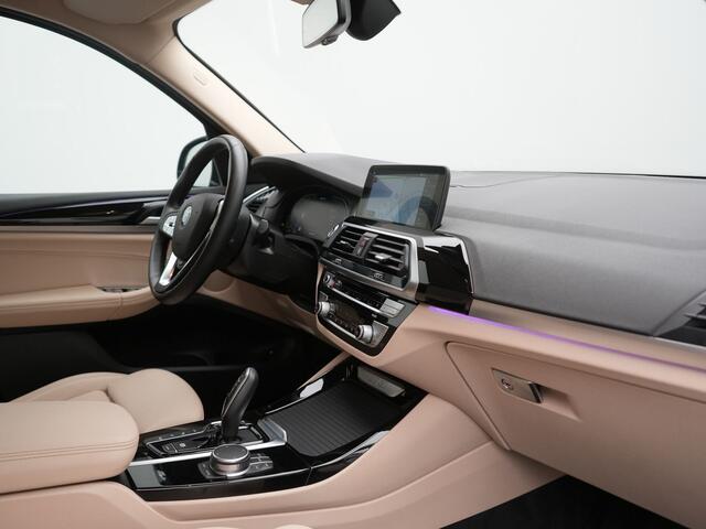 BMW X3 xDrive30e Business Edition Plus PHEV 293pk Dealer O.H. | Trekhaak Af Fabriek | Adaptive Cruise | 360 Camera | Adaptief Onderstel | Lederen Sportstoelen Memory & Ventilatie | Sfeerverlichting | Stoelen & Stuur Verwarmd | Keyless | Blis | Plug In Hybrid |