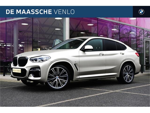 BMW X4 xDrive20i High Executive M Sport Automaat / Panoramadak / Trekhaak / Sportstoelen / Adaptief onderstel / Stuurverwarming / Adaptieve LED / Parking Assistant Plus / Head-Up / Harman Kardon