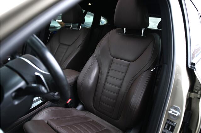 BMW X4 xDrive20i High Executive M Sport Automaat / Panoramadak / Trekhaak / Sportstoelen / Adaptief onderstel / Stuurverwarming / Adaptieve LED / Parking Assistant Plus / Head-Up / Harman Kardon