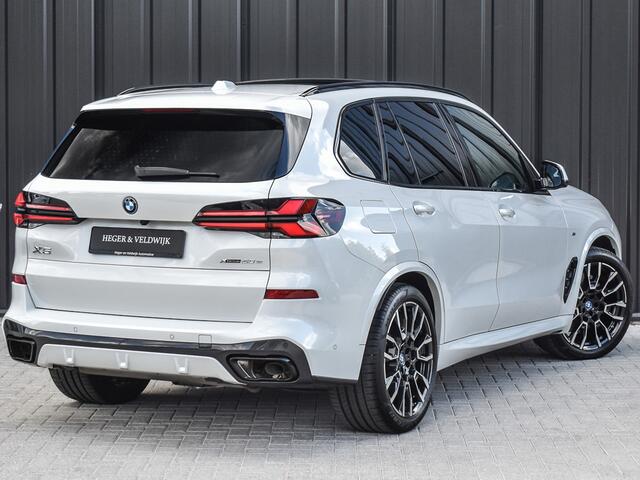 BMW X5 xDrive50e | M-SPORT | PANORAMADAK | LUCHTVERING | DRIVING ASSISTANT | ACTIVE CRUISE | COMFORT ACCESS | ICONIC GLOW | COMFORT SEATS | AMBIANCE INTERIEUR | HARMAN/KARDON | 360 CAMERA | DAB+ |