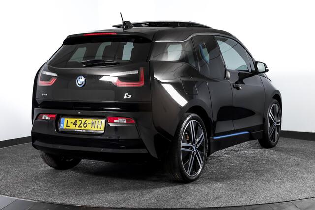 BMW i3 Basis 94Ah 33 kWh | S/k-panodak | Harman/Kardon | Dig. Cockpit | Adapt. cruise | Stoelverw. | PDC | Camera | NAV | ECC | LM 20" |