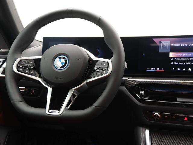 BMW i4 eDrive40 84 kWh | M-Sport Pro | Tartufo Interieur | Driving Assistant Professional | Carbon Inleg |