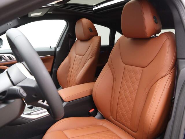 BMW i4 eDrive40 84 kWh | M-Sport Pro | Tartufo Interieur | Driving Assistant Professional | Carbon Inleg |