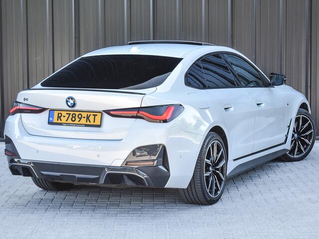 BMW i4 eDrive40 High EXECUTIVE 84 kWh | M-SPORT | SCHUIFDAK | SHADOW-LINE | NL- AUTO | CAMERA | HEAD-UP | TREKHAAK | MEMORY SEATS | AMBIANCE INTERIEUR |