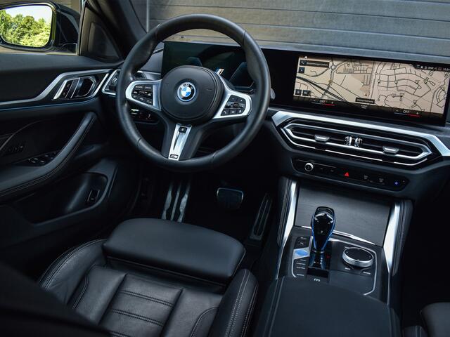 BMW i4 eDrive40 High EXECUTIVE 84 kWh | M-SPORT | SCHUIFDAK | SHADOW-LINE | NL- AUTO | CAMERA | HEAD-UP | TREKHAAK | MEMORY SEATS | AMBIANCE INTERIEUR |
