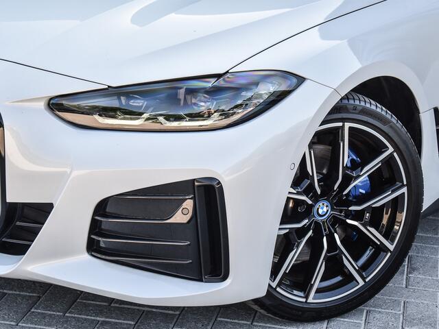 BMW i4 eDrive40 High EXECUTIVE 84 kWh | M-SPORT | SCHUIFDAK | SHADOW-LINE | NL- AUTO | CAMERA | HEAD-UP | TREKHAAK | MEMORY SEATS | AMBIANCE INTERIEUR |