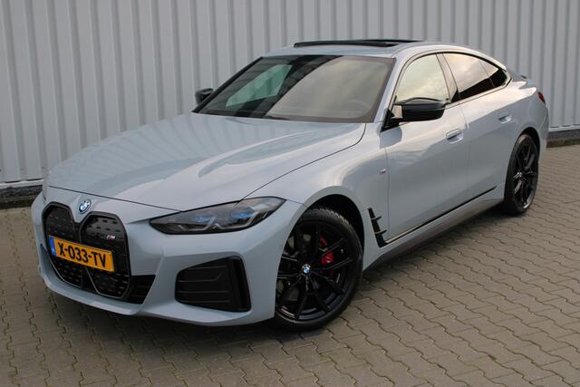 BMW i4 M50 High Executive 84 kWh | Incl. 12 maanden garantie | Assisted driving | Climate control | 360° camera | Uitklapbare trekhaak | Stoel/stuurverwarming | Head-up display | Schuif/kantel dak |