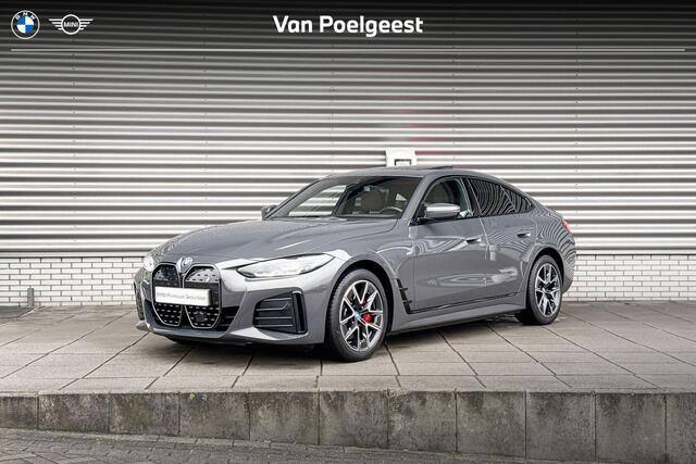 BMW i4 eDrive40 M Sportpakket Pro / High Executive / Achteruitrijcamera / Elektrisch bediend glazen schuif-/kanteldak / Elektrisch verwarmde voorstoelen