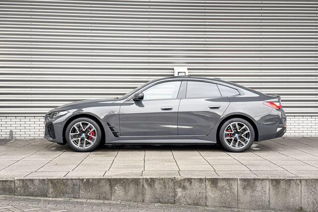 BMW i4 eDrive40 M Sportpakket Pro / High Executive / Achteruitrijcamera / Elektrisch bediend glazen schuif-/kanteldak / Elektrisch verwarmde voorstoelen