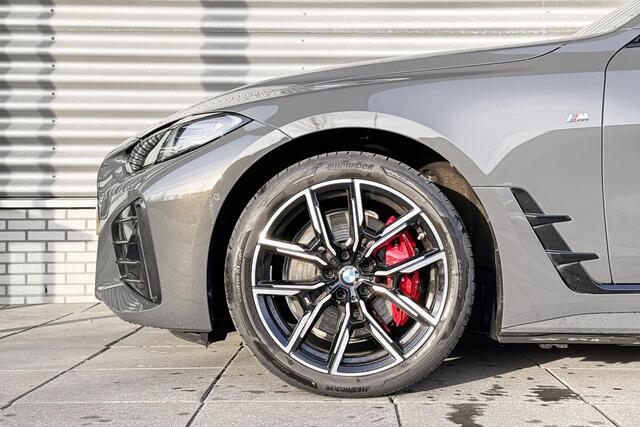 BMW i4 eDrive40 M Sportpakket Pro / High Executive / Achteruitrijcamera / Elektrisch bediend glazen schuif-/kanteldak / Elektrisch verwarmde voorstoelen