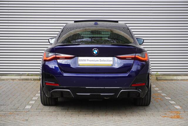 BMW i4 eDrive35 M Sportpakket | Comfort Pack | Stuurwielrand verwarmd | Trekhaak met elektrisch wegklapbare kogel | Elektrisch bediend glazen schuif-/kanteldak | Extra getint glas