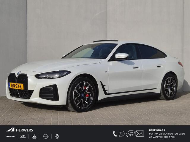 BMW i4 eDrive35 M Sport Edition 70 kWh / SOH 100% / CCS Snel Lader / Panoramadak / Lederen Bekleding / Adaptief Cruise Control / Dealer Onderhouden / Wide Screen Display / Stoelverwarming / Trekgewicht 1600 kg / Apple Carplay Android Auto /