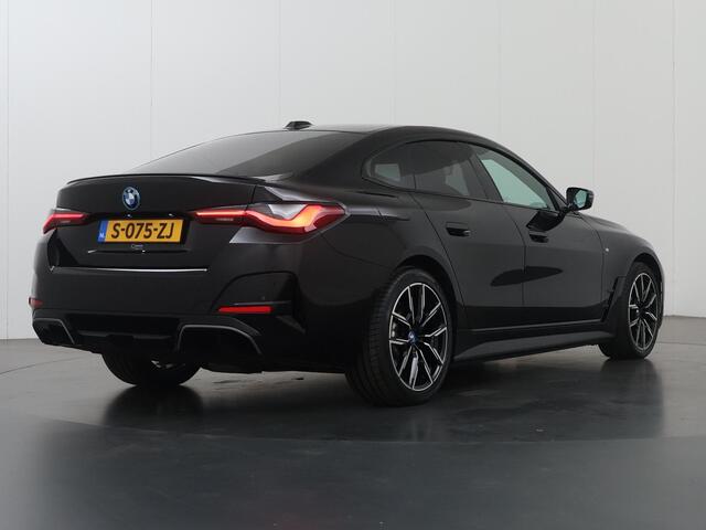 BMW i4 eDrive35 High Executive 70 kWh | M-Pakket | SOH 96% | HUD | Sportstoelen elektrisch verstelbaar + Geheugen | Camera | DAB | Apple CarPlay/Android Auto | Adaptieve Cruise Control | Ele. kofferdeksel |