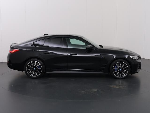 BMW i4 eDrive35 High Executive 70 kWh | M-Pakket | SOH 96% | HUD | Sportstoelen elektrisch verstelbaar + Geheugen | Camera | DAB | Apple CarPlay/Android Auto | Adaptieve Cruise Control | Ele. kofferdeksel |