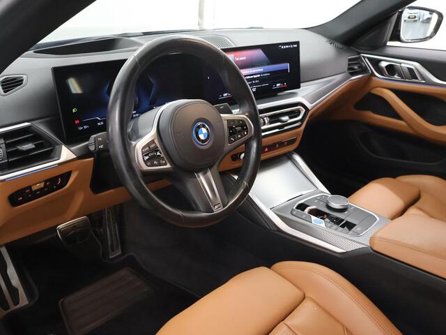 BMW i4 eDrive35 High Executive 70 kWh | M-Pakket | SOH 96% | HUD | Sportstoelen elektrisch verstelbaar + Geheugen | Camera | DAB | Apple CarPlay/Android Auto | Adaptieve Cruise Control | Ele. kofferdeksel |
