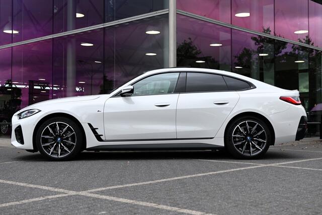 BMW i4 eDrive40 High Executive M Sport / Achteruitrijcamera / Comfort Access / Active Cruise Control / Live Cockpit Professional / Stoelverwarming