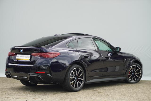 BMW i4 eDrive40 | M Sportpakket Pro | Harman Kardon | Active Cruise Control | Elektrisch verstelbare stoelen | Trekhaak