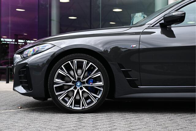 BMW i4 eDrive40 High Executive M Sport / Schuif-kanteldak / Trekhaak / M Sportstoelen / Comfort Access / Parking Assistant Plus / Stuurverwarming