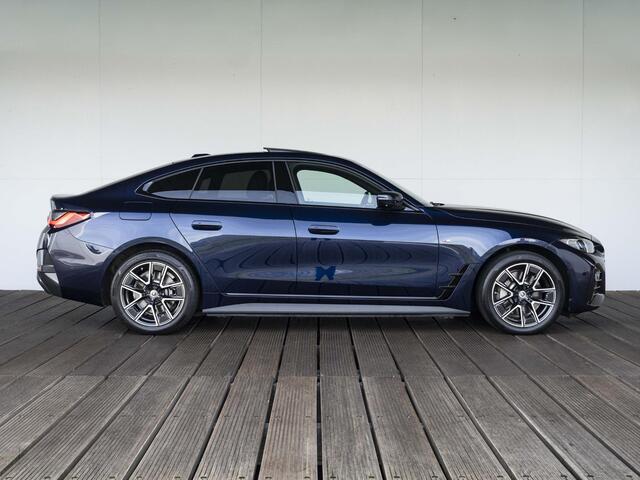 BMW i4 eDrive40 | High Executive | M Sport | Schuif-/kanteldak | Driving Assistant Professional | Stuurwielrand verwarmd | Head Up Display