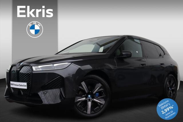 BMW iX xDrive40 Business Edition Plus 77 kWh Sportpakket / High Executive / Comfort Access / Trekhaak met elektrisch wegklapbare kogel / panoramadak Sky Lounge / Harman Kardon