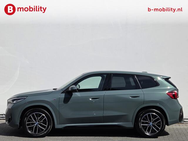 BMW iX1 eDrive20 67 kWh M-Sport SOH 99% Driving Assist. Plus | Sportstoelen | Park Assist | Leer | Adaptive Cruise Control | DAB | NL Auto! | Achteruitrijcamera