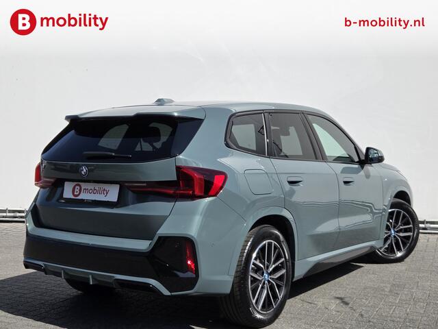 BMW iX1 eDrive20 67 kWh M-Sport SOH 99% Driving Assist. Plus | Sportstoelen | Park Assist | Leer | Adaptive Cruise Control | DAB | NL Auto! | Achteruitrijcamera