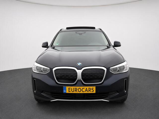 BMW iX3 High Executive Edition 80 kWh SOH 98,6% Panoramadak Trekhaak Navigatie Apple CarPlay Android Auto Camera Parkeerhulp Adaptive Cruise Control Stoelverwarming Full Led Leder Climate Control Lichtmetalen velgen