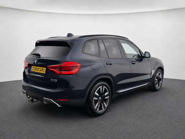 BMW iX3 High Executive Edition 80 kWh SOH 98,6% Panoramadak Trekhaak Navigatie Apple CarPlay Android Auto Camera Parkeerhulp Adaptive Cruise Control Stoelverwarming Full Led Leder Climate Control Lichtmetalen velgen