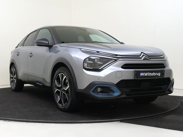 Citroen ë-C4 Shine 50 kWh I AUTOMAAT I NAVIGATIE I ACHTERUITRIJCAMERA I PARKEERSENSOREN VOOR EN ACHTER I KEYLESS ENTRY I HEAD-UP DISPLAY I VERWARMD STUURWIEL I